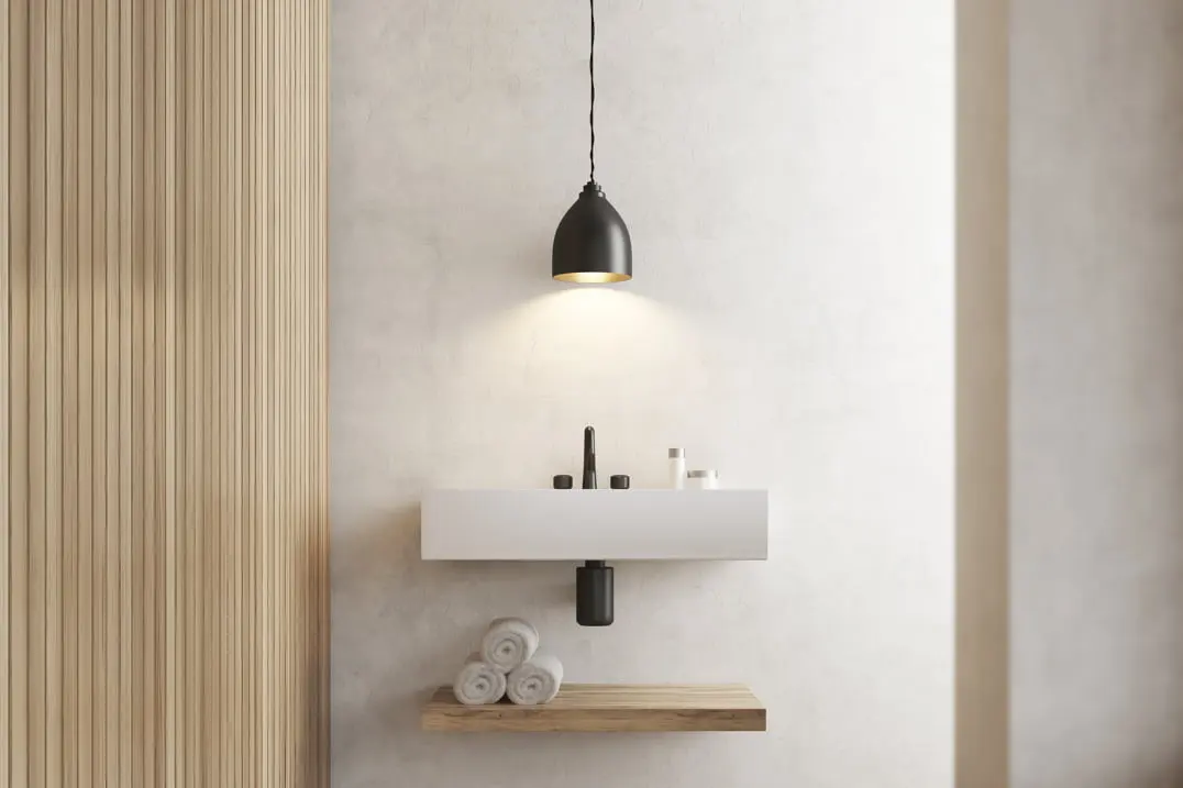 Microcemento en la pared y el lavabo de un baño de estilo minimalista